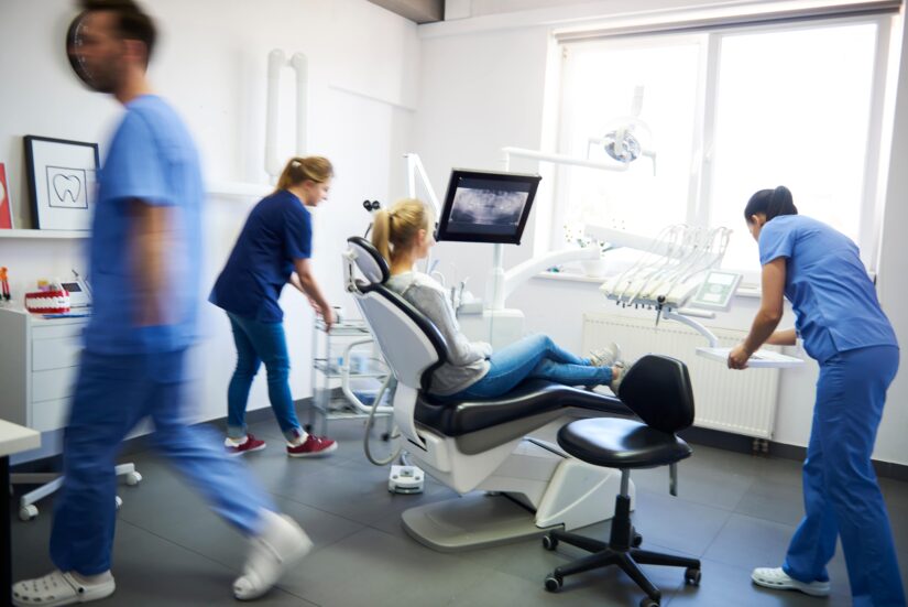 Photo of Dentist Cabinet with Crew and Patient