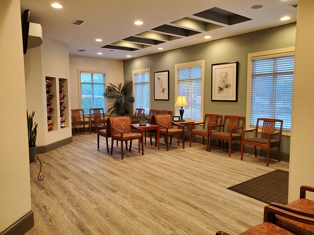 Compartment With Lot Of Chairs And Paitings On The Wall