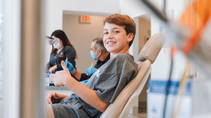 Boy At Dentists Office Showing Approval