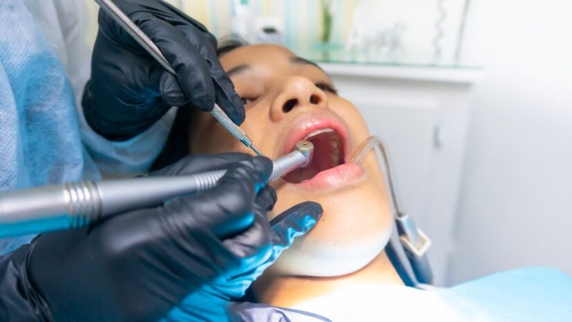 Dentist drilling teeth